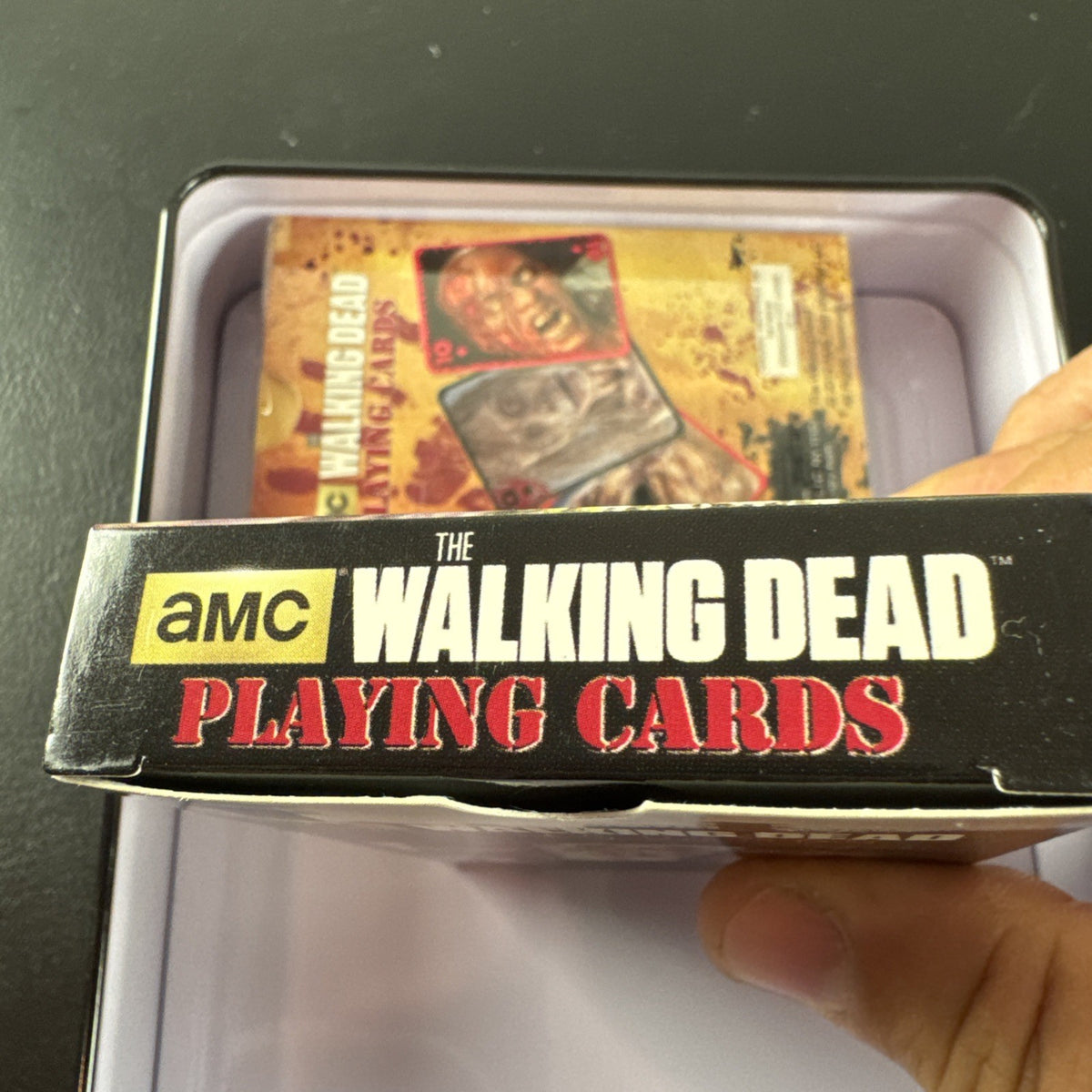 The Walking Dead playing card set with two decks and metal tin by Cardinal featuring Daryl and Merle Dixon.