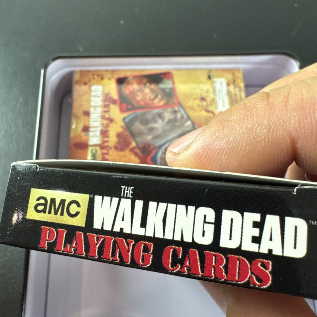 The Walking Dead playing card set with two decks and metal tin by Cardinal featuring Daryl and Merle Dixon.