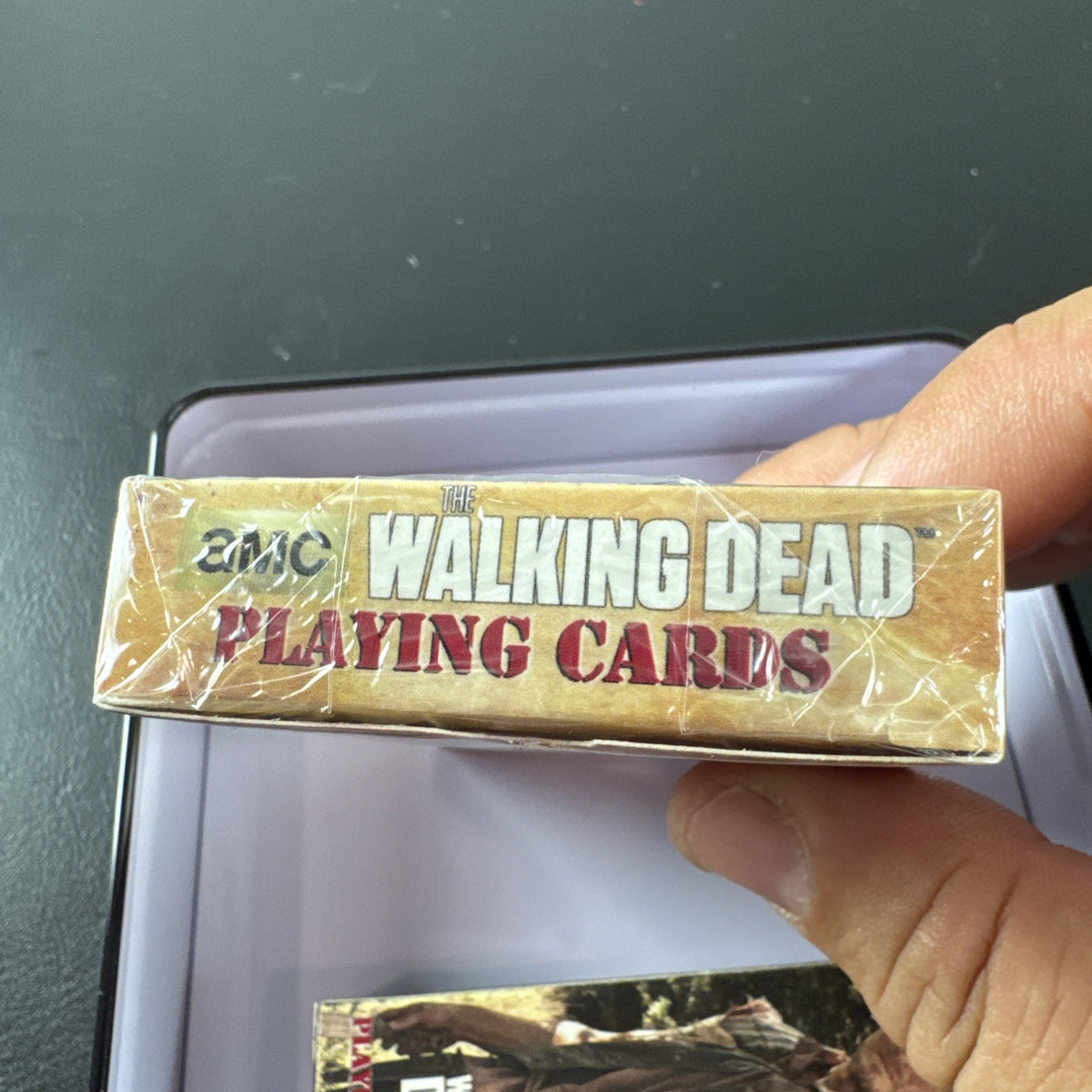 The Walking Dead playing card set with two decks and metal tin by Cardinal featuring Daryl and Merle Dixon.