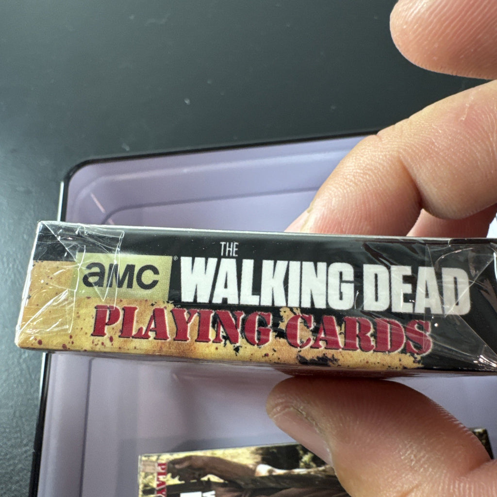 The Walking Dead playing card set with two decks and metal tin by Cardinal featuring Daryl and Merle Dixon.