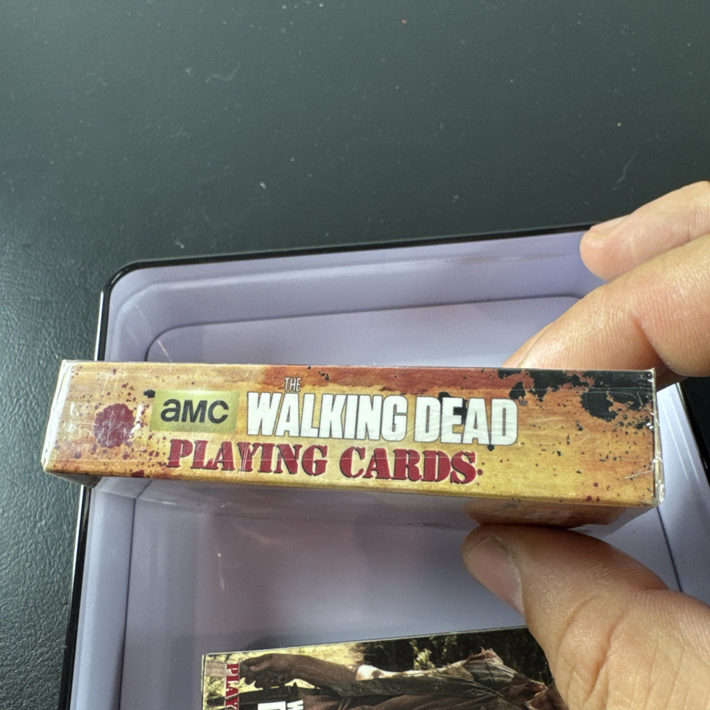 The Walking Dead playing card set with two decks and metal tin by Cardinal featuring Daryl and Merle Dixon.