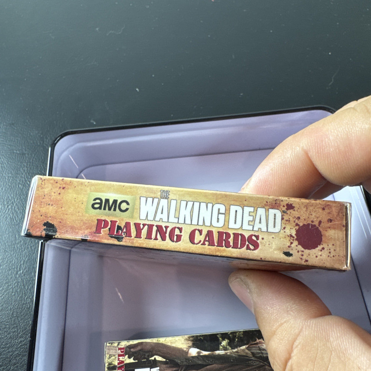 The Walking Dead playing card set with two decks and metal tin by Cardinal featuring Daryl and Merle Dixon.