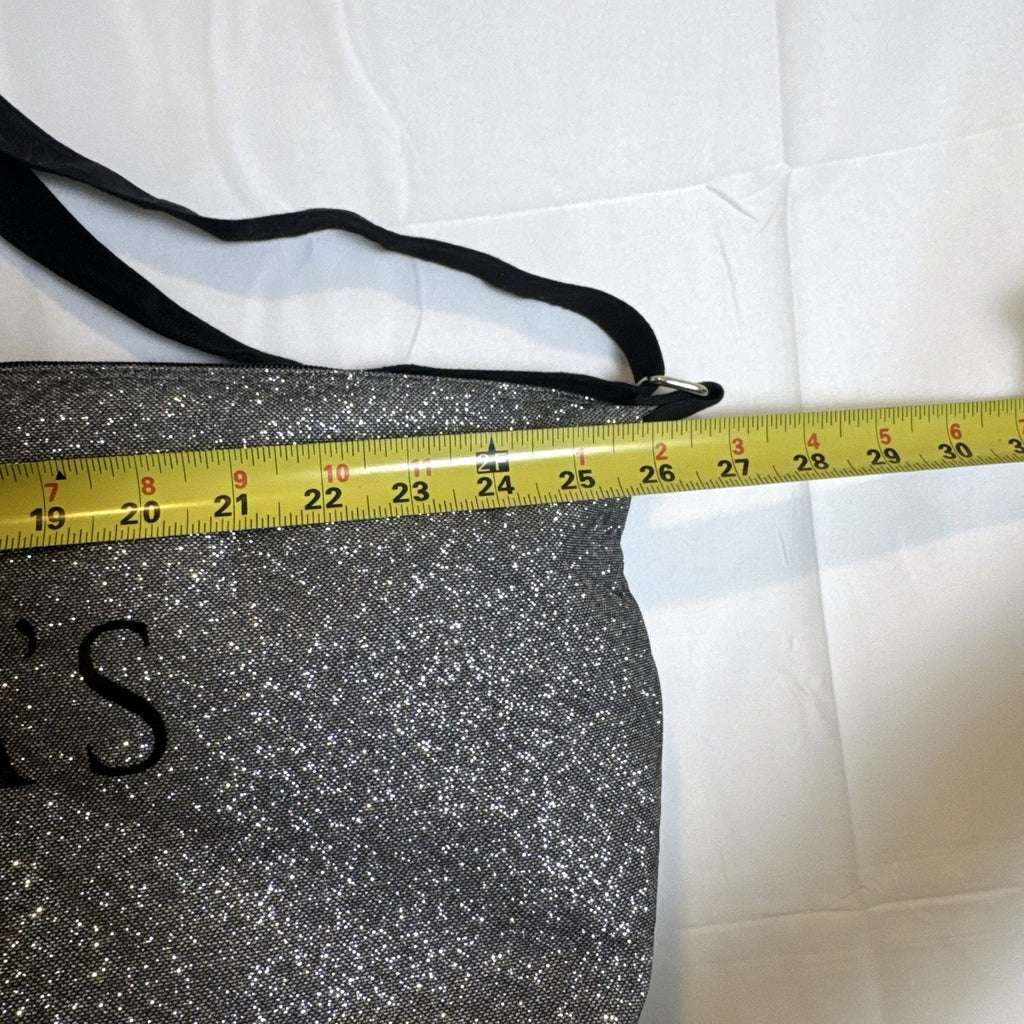 Victoria's Secret oversized silver glitter weekender tote bag with London New York Paris graphic and black canvas handles.
