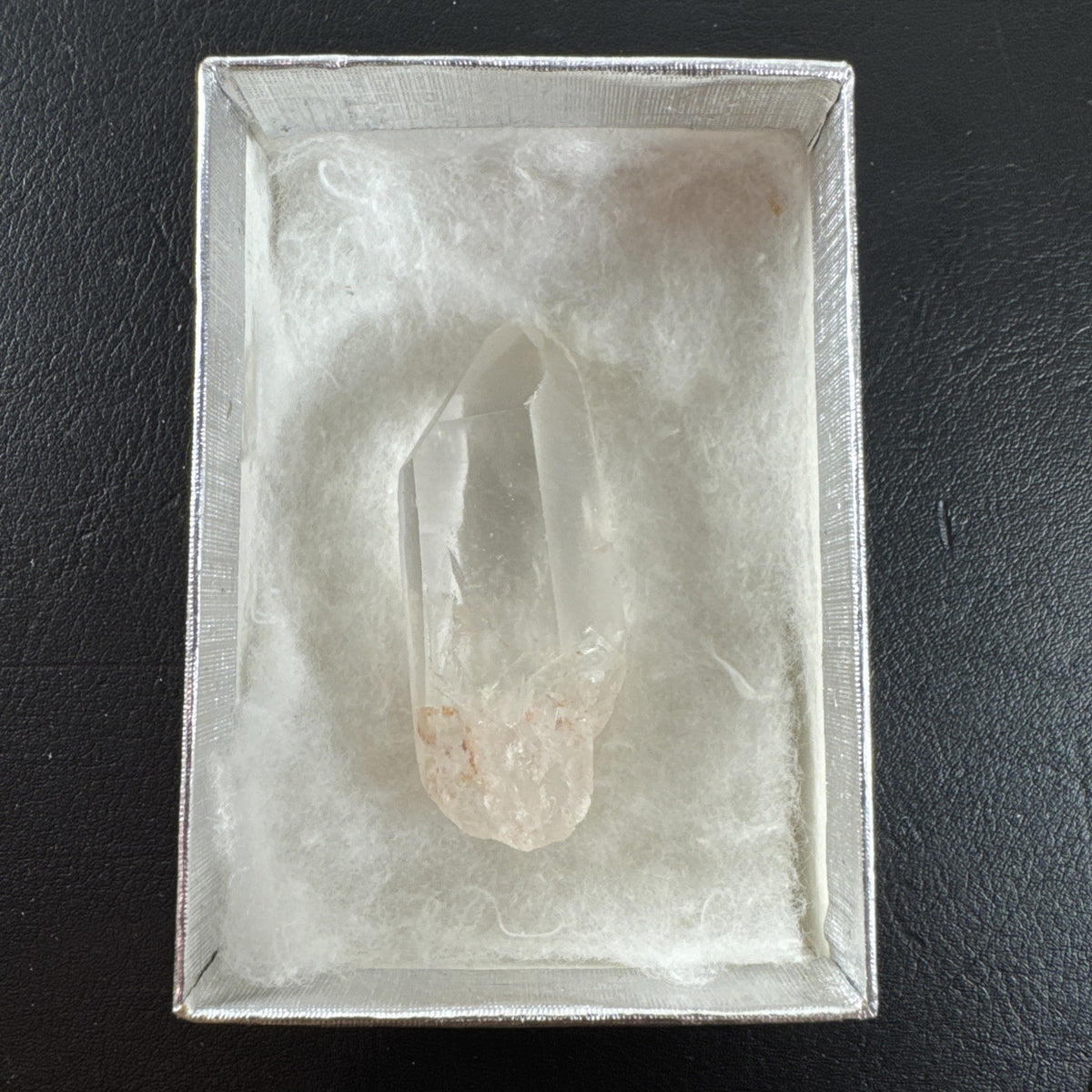 Raw Brazilian Lemurian clear quartz crystal point weighing 24.3g with natural horizontal striations and silver gift box