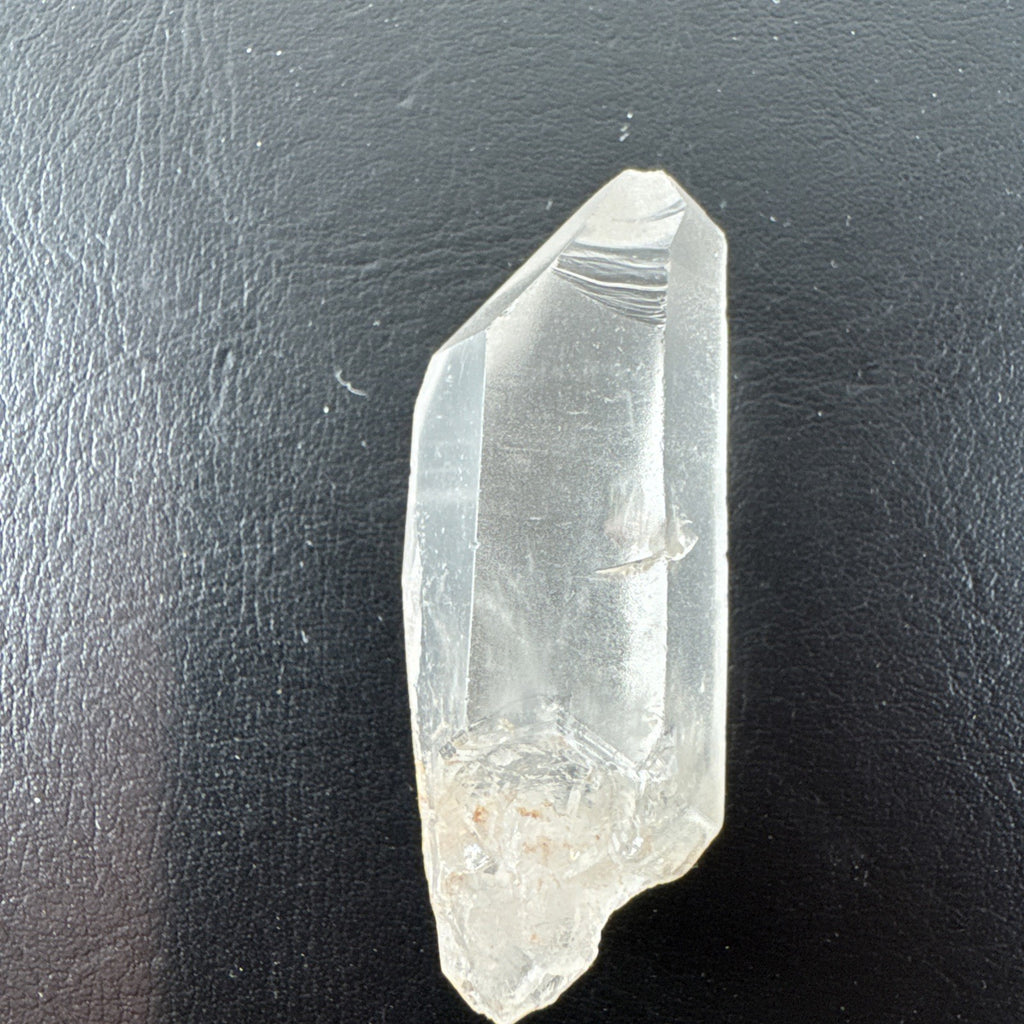 Raw Brazilian Lemurian clear quartz crystal point weighing 24.3g with natural horizontal striations and silver gift box