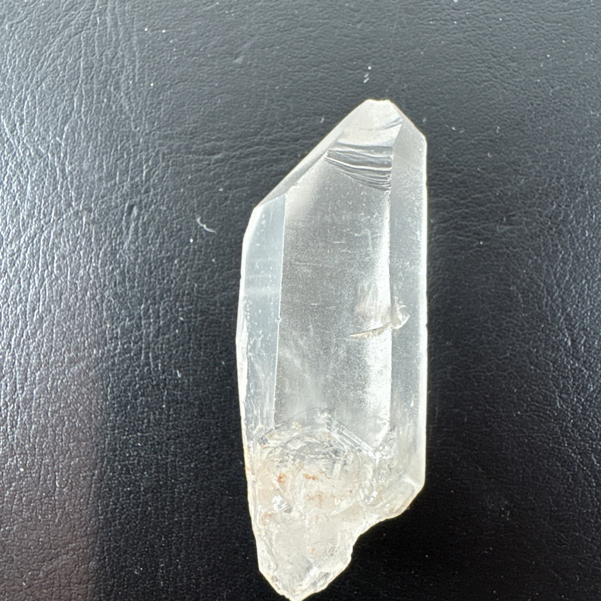 Raw Brazilian Lemurian clear quartz crystal point weighing 24.3g with natural horizontal striations and silver gift box