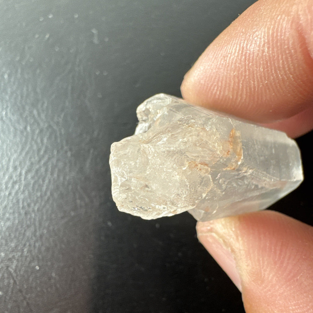 Raw Brazilian Lemurian clear quartz crystal point weighing 24.3g with natural horizontal striations and silver gift box