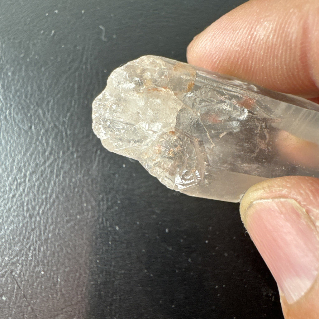 Raw Brazilian Lemurian clear quartz crystal point weighing 24.3g with natural horizontal striations and silver gift box