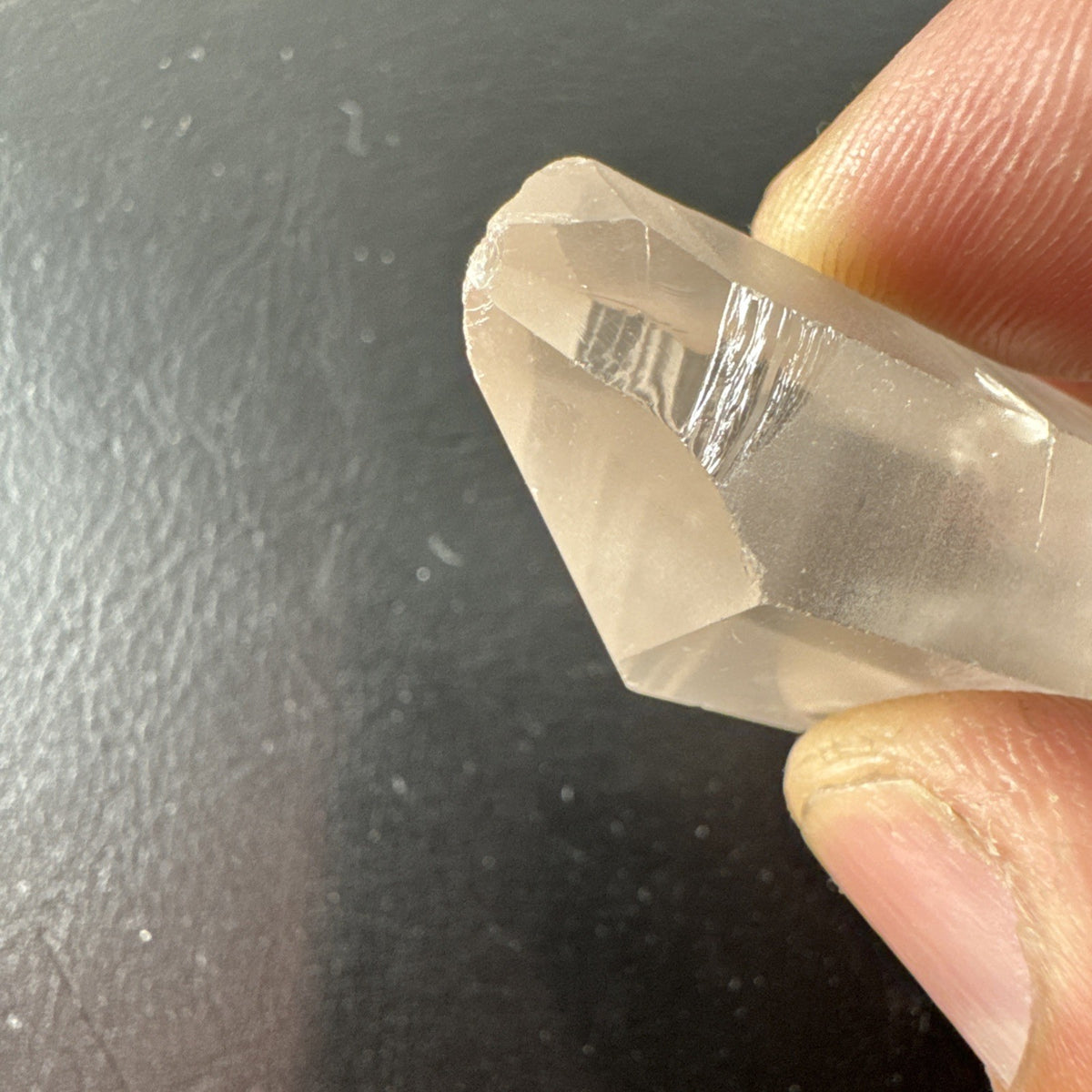 Raw Brazilian Lemurian clear quartz crystal point weighing 24.3g with natural horizontal striations and silver gift box