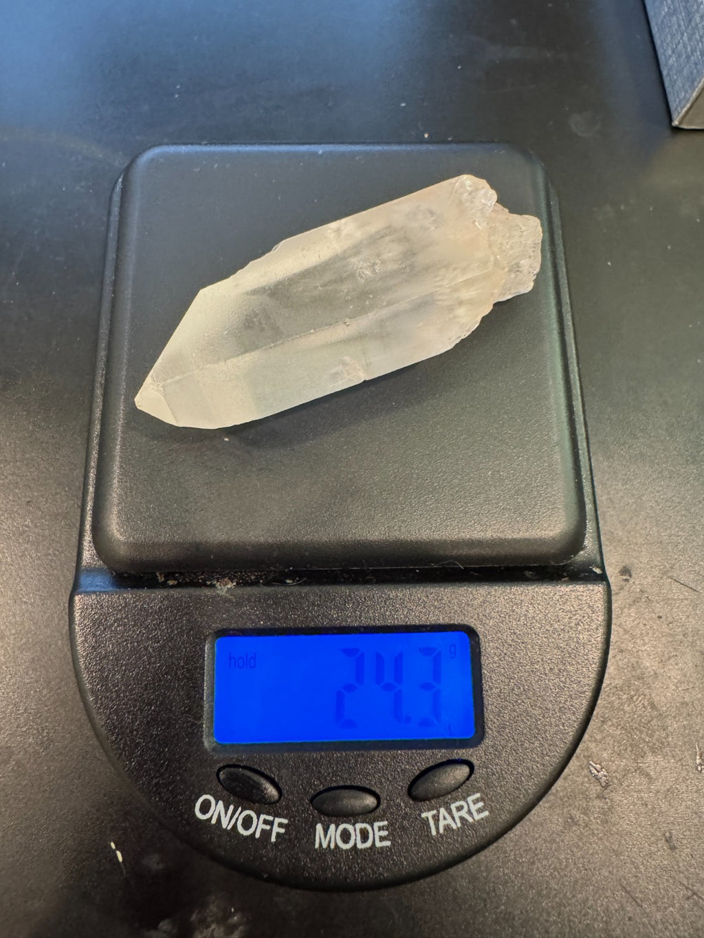Raw Brazilian Lemurian clear quartz crystal point weighing 24.3g with natural horizontal striations and silver gift box
