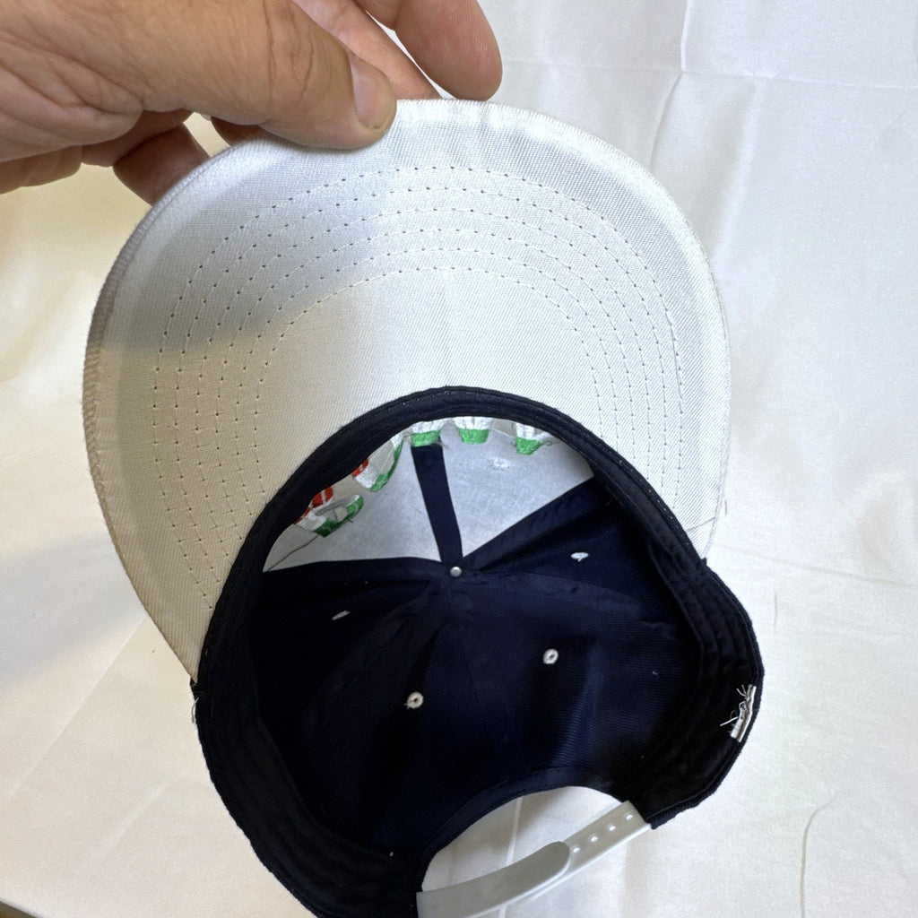 Set of 3 snapback hats including a grey Hurley youth cap, black H&M faux leather hat, and navy blue ROMA cap.