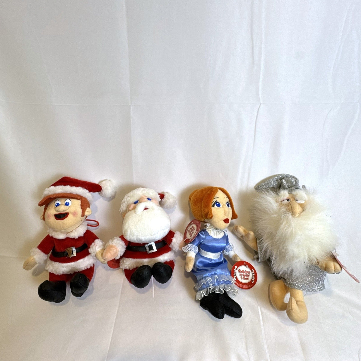 Set of 4 NWT 2003 Stuffins Santa Claus Is Comin' To Town plush ornaments including Kris Kringle and Winter Warlock