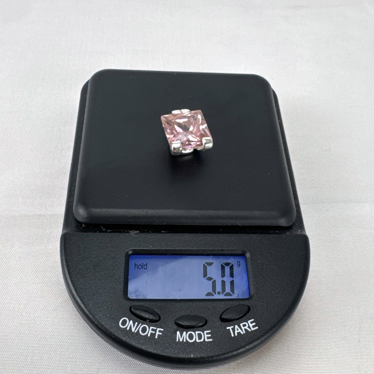 925 sterling silver slide pendant enhancer featuring a brilliant pink cubic zirconia gemstone.
