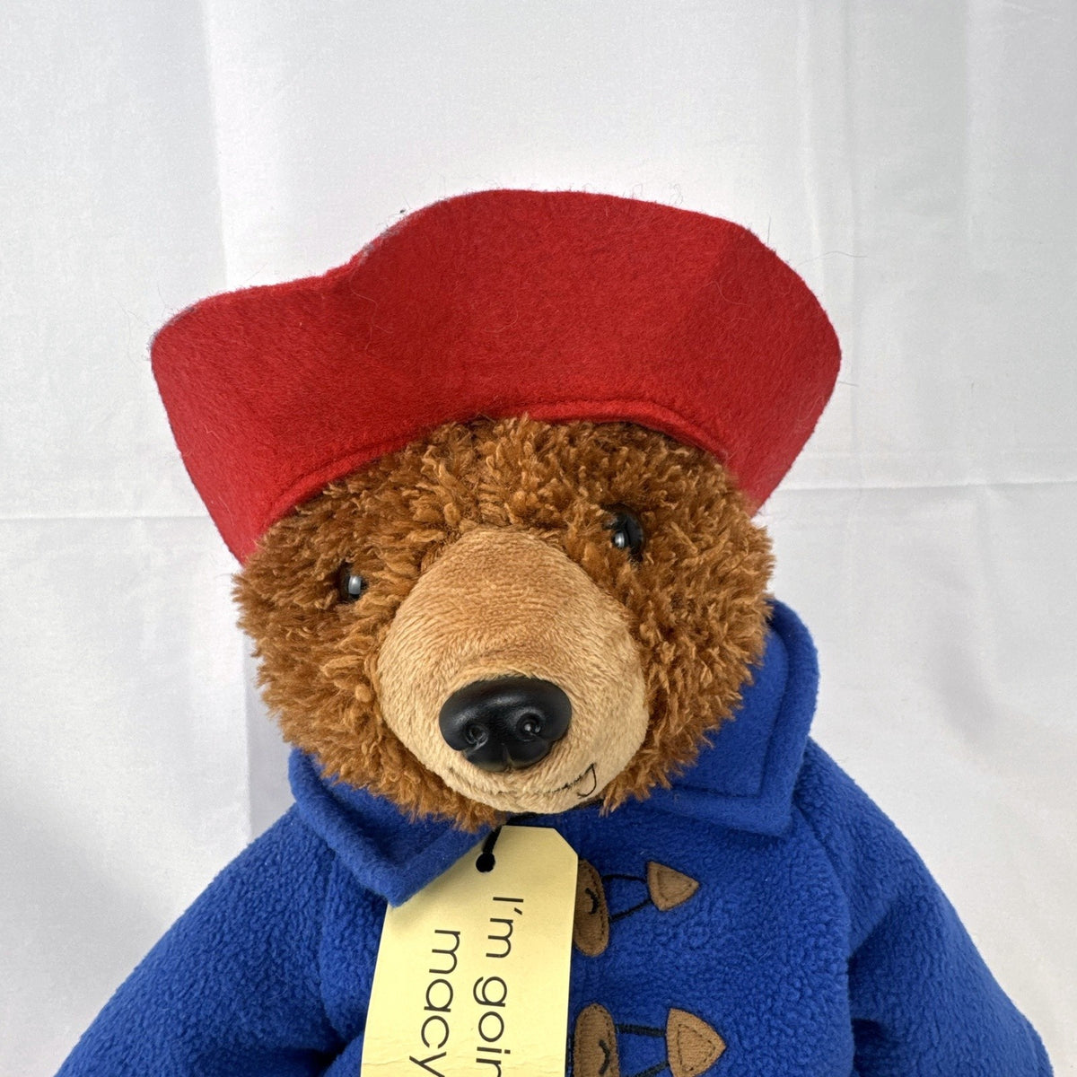 2014 Yottoy 11-inch Paddington Bear plush with blue fleece duffle coat, red hat, and Macy's luggage tag