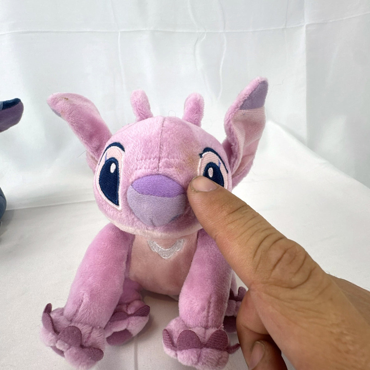 Disney Store 3-piece plush set including NWT Pascal coin purse clip and 6-inch Stitch and Angel mini plushies.
