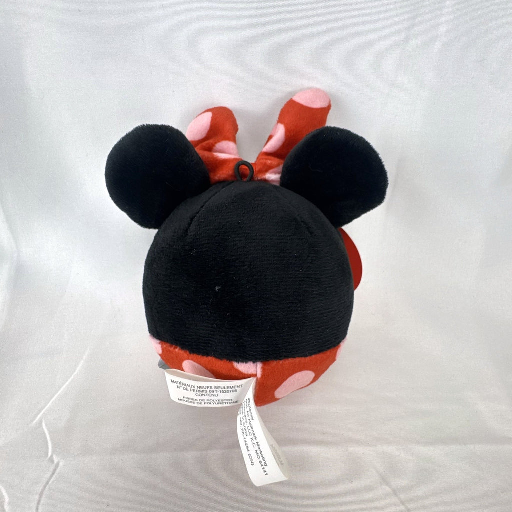 Hallmark Fluffballs Disney Minnie Mouse 4 inch plush ornament with red polka dot bow and new tags attached.
