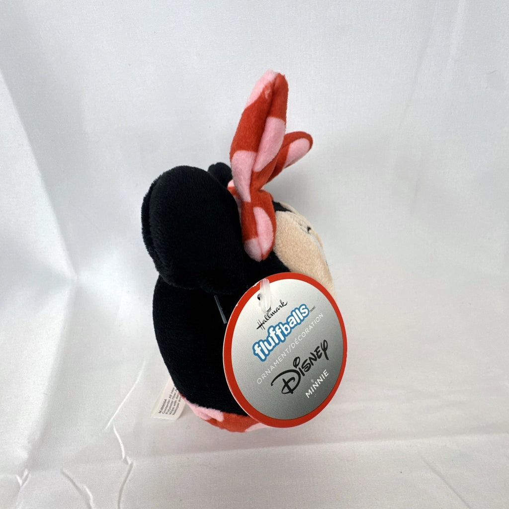 Hallmark Fluffballs Disney Minnie Mouse 4 inch plush ornament with red polka dot bow and new tags attached.