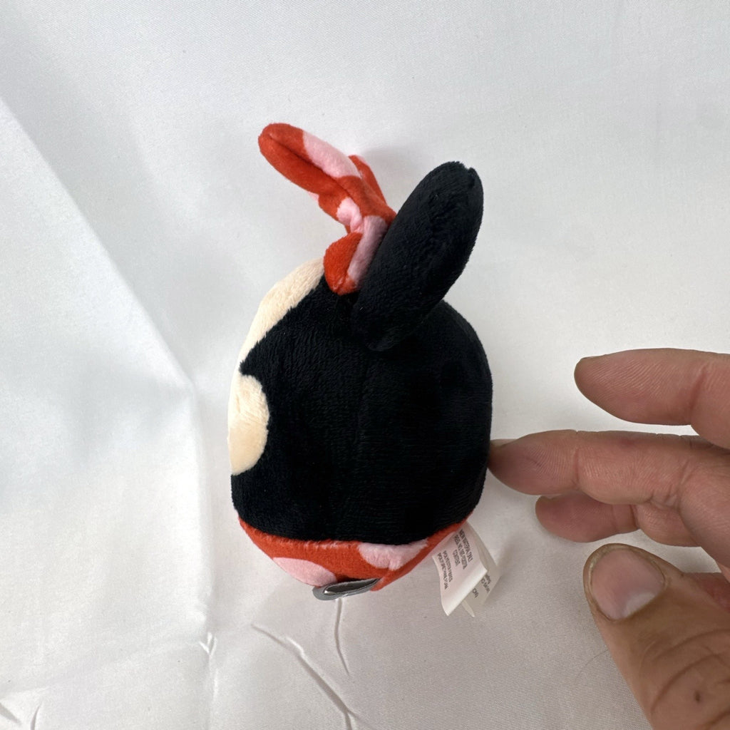 Hallmark Fluffballs Disney Minnie Mouse 4 inch plush ornament with red polka dot bow and new tags attached.