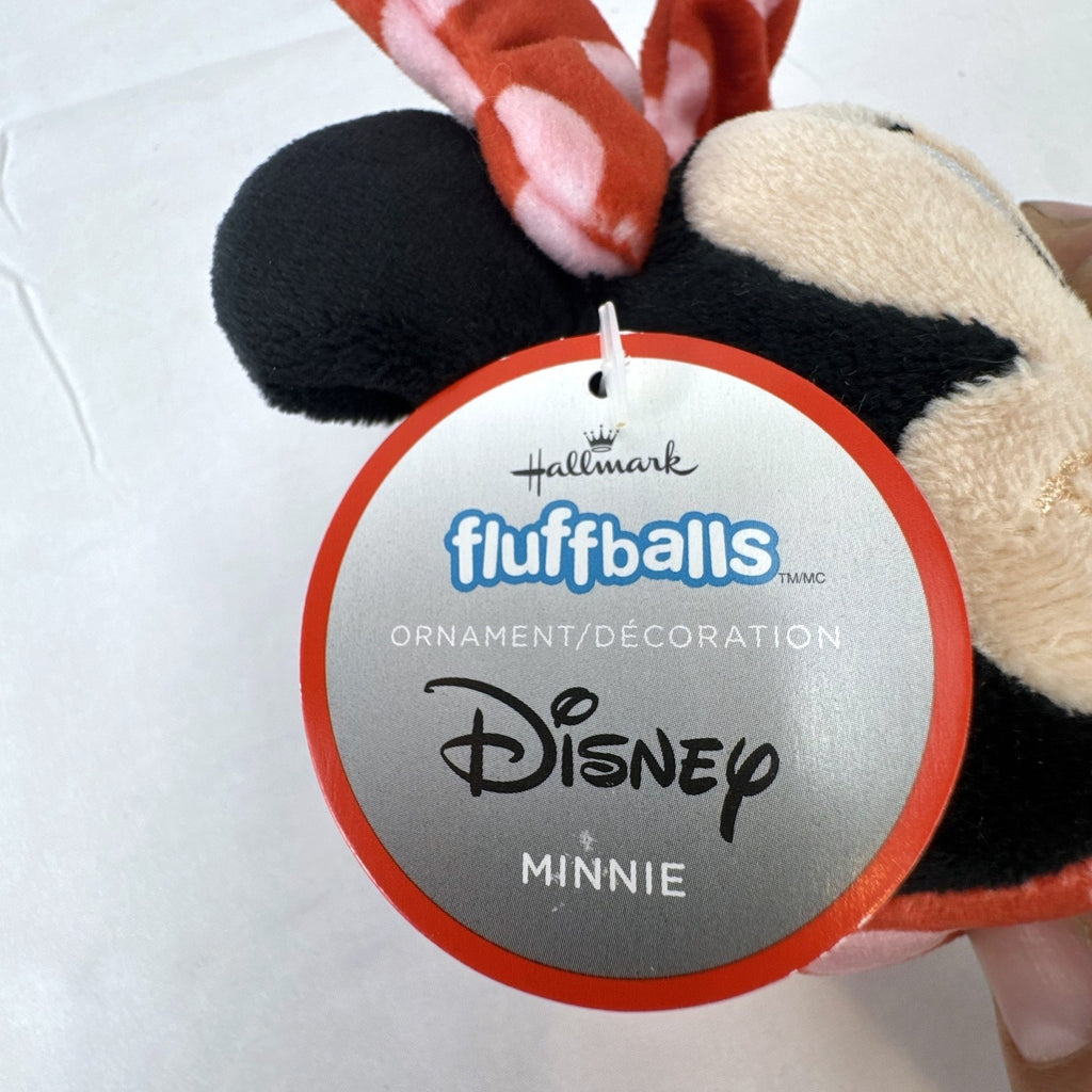 Hallmark Fluffballs Disney Minnie Mouse 4 inch plush ornament with red polka dot bow and new tags attached.