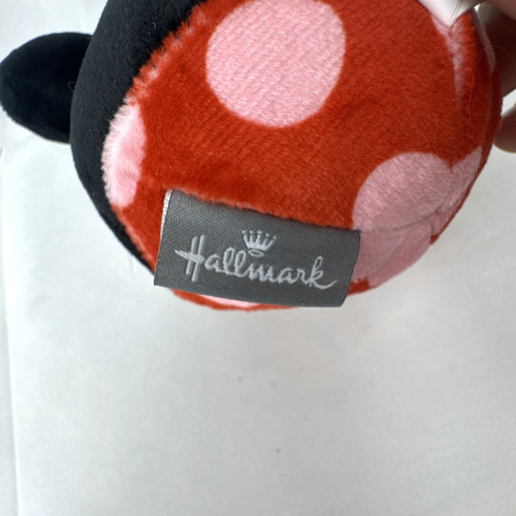 Hallmark Fluffballs Disney Minnie Mouse 4 inch plush ornament with red polka dot bow and new tags attached.