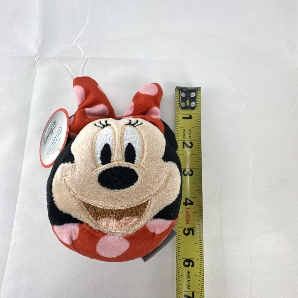 Hallmark Fluffballs Disney Minnie Mouse 4 inch plush ornament with red polka dot bow and new tags attached.