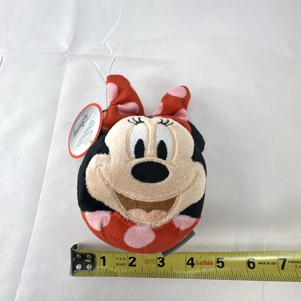 Hallmark Fluffballs Disney Minnie Mouse 4 inch plush ornament with red polka dot bow and new tags attached.