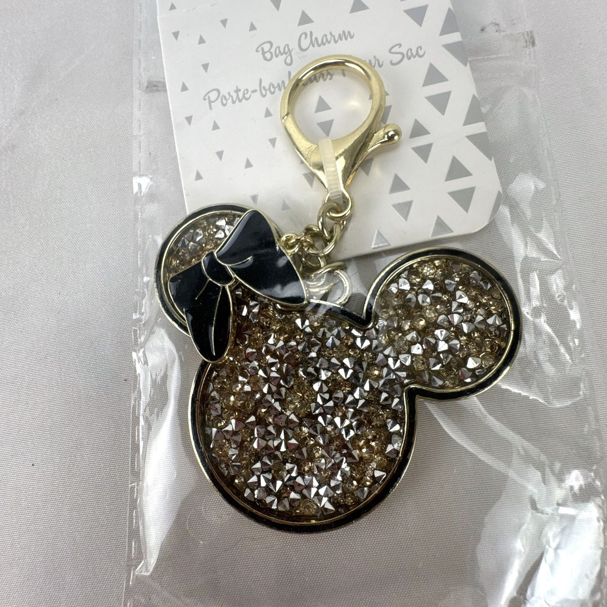 Disney Minnie Mouse crystal pave rhinestone bag charm and keychain with black enamel bow in gold-tone setting
