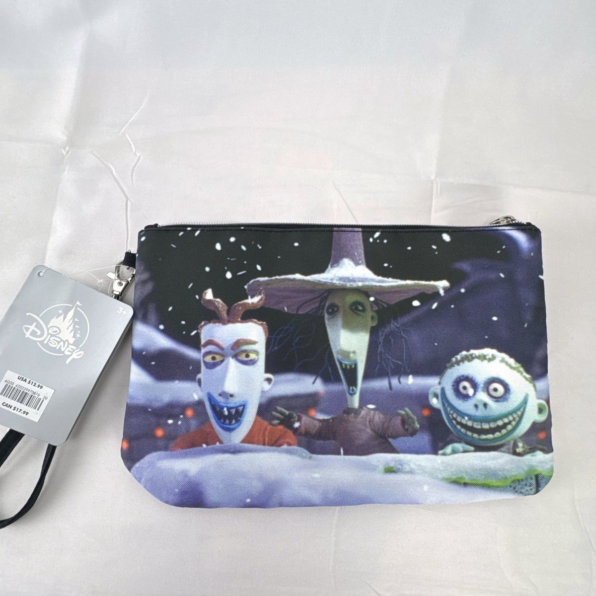 New Disney The Nightmare Before Christmas small black cosmetic pouch featuring character artwork and a wrist strap