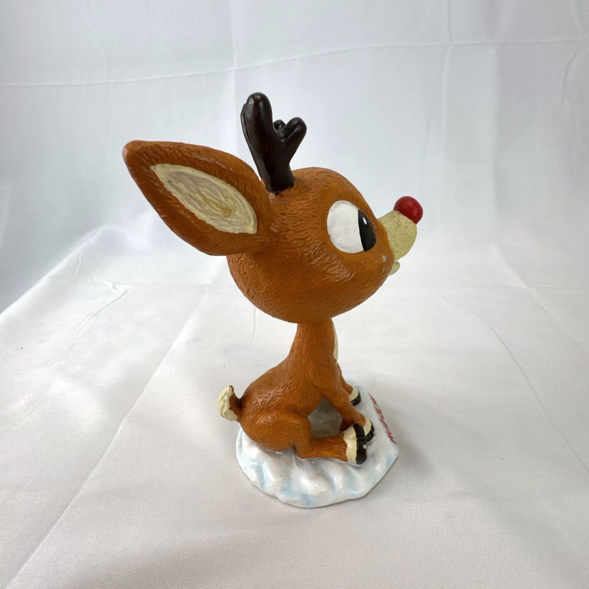 BD&A 6 inch painted ceramic Rudolph the Red-Nosed Reindeer bobblehead holiday figurine.