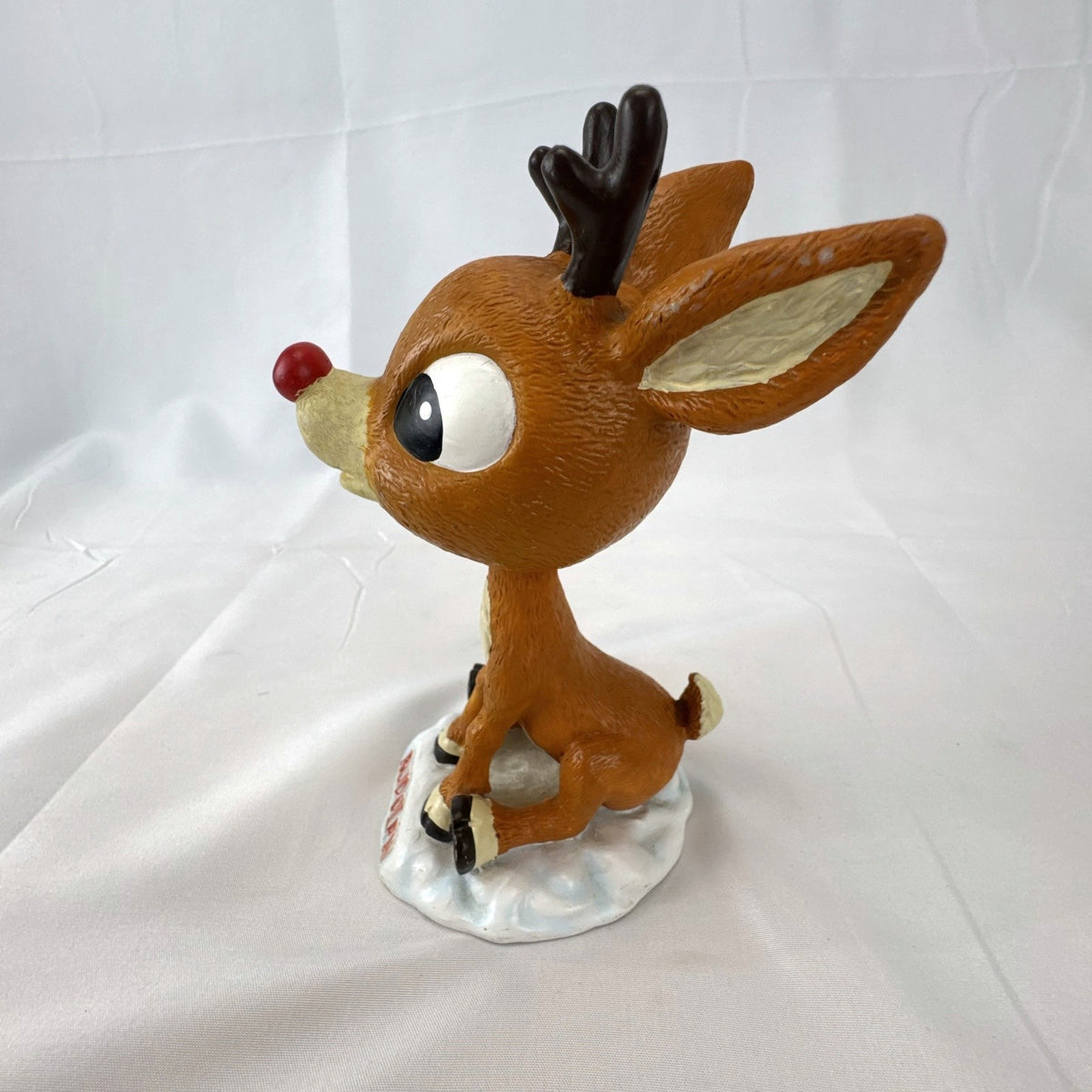BD&A 6 inch painted ceramic Rudolph the Red-Nosed Reindeer bobblehead holiday figurine.
