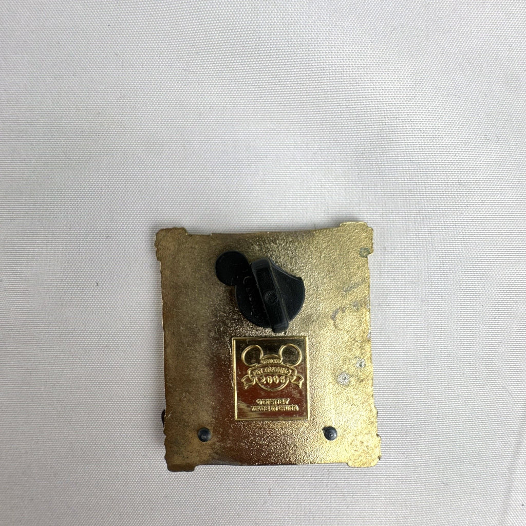 Disney 2006 Pirates of the Caribbean Captain Jack Sparrow enamel pin with gold-tone crossed swords frame