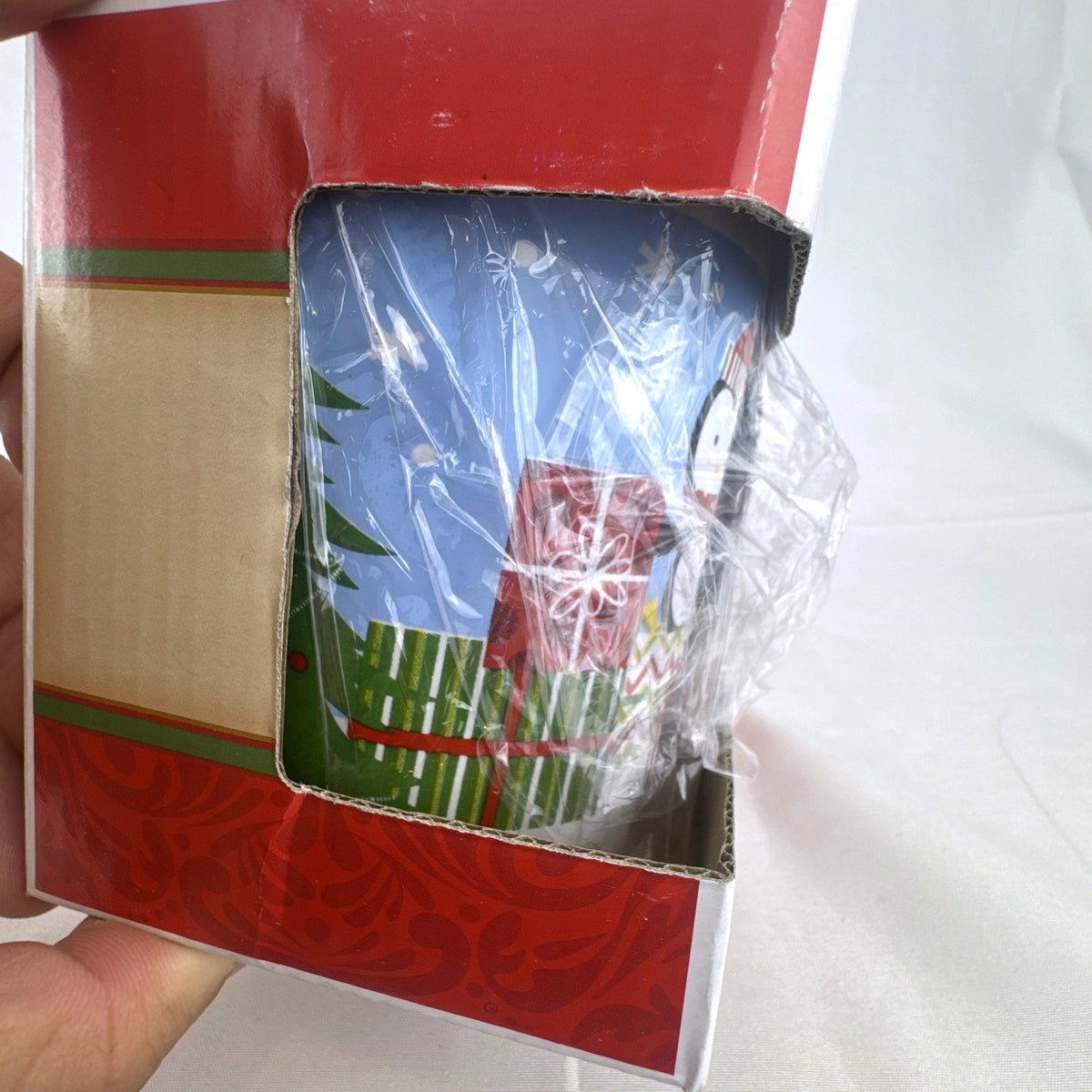 Greenbrier 14 oz blue ceramic holiday coffee mug featuring a bundled winter penguin design in original box
