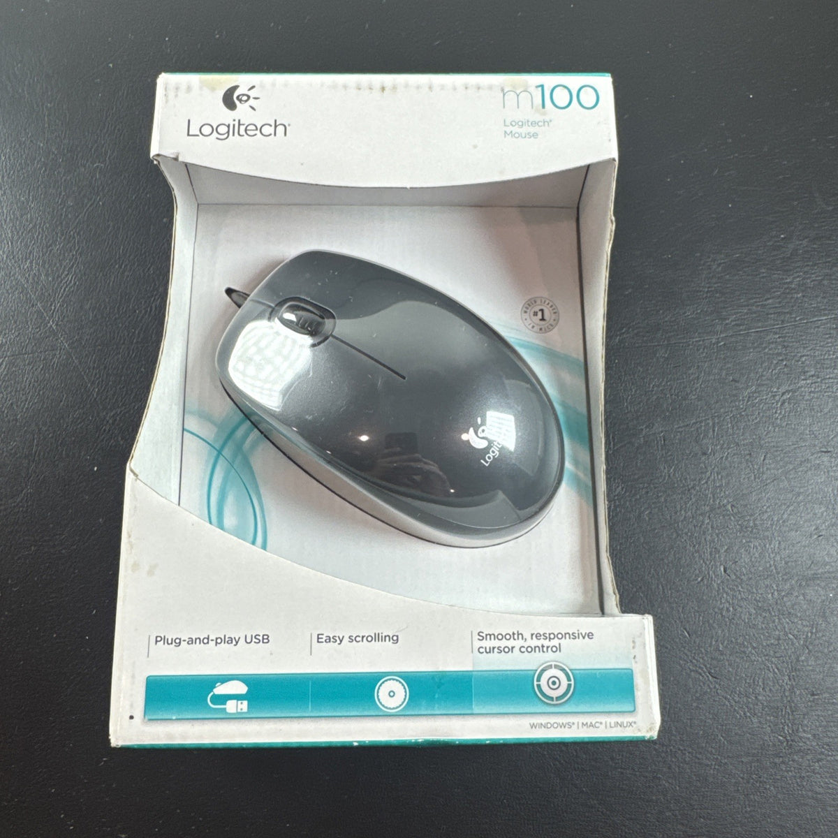 Brand new black Logitech M100 wired USB optical computer mouse in original packaging.