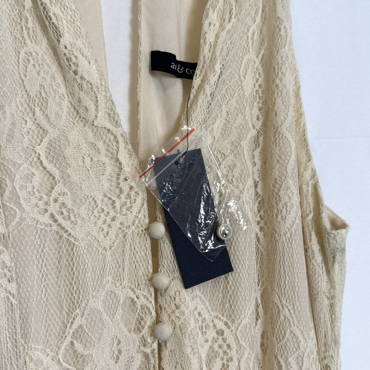 Ark & Co. brand new with tags ivory floral lace halter maxi dress featuring an open back and tassel waist belt
