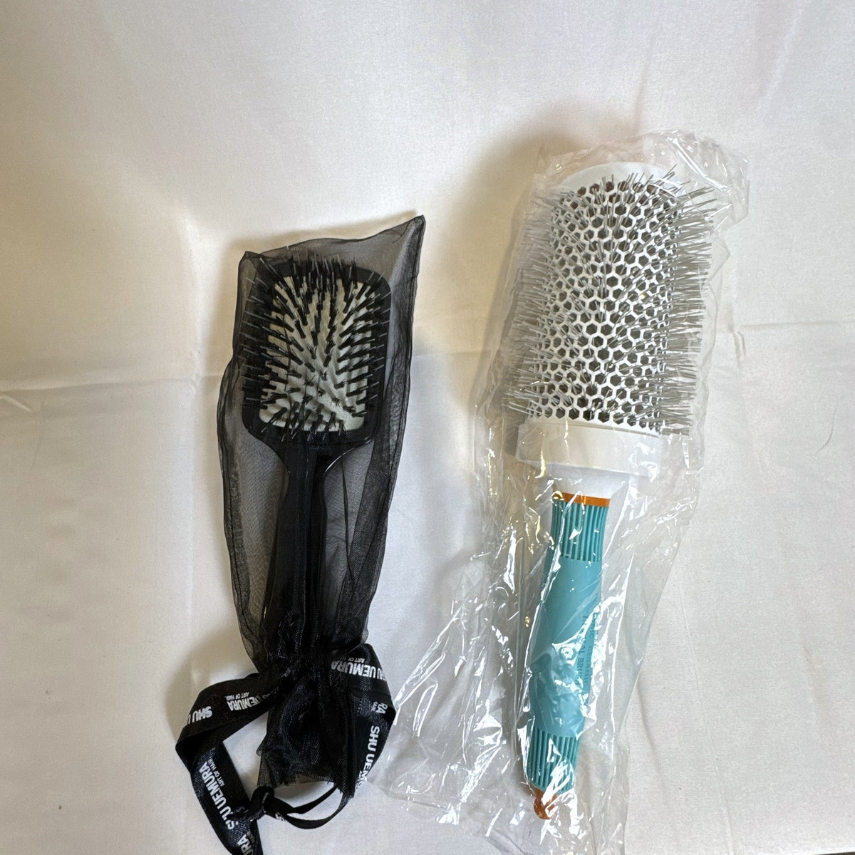 New Moroccanoil 55mm ceramic round brush and Shu Uemura Acca Kappa paddle brush set in original packaging