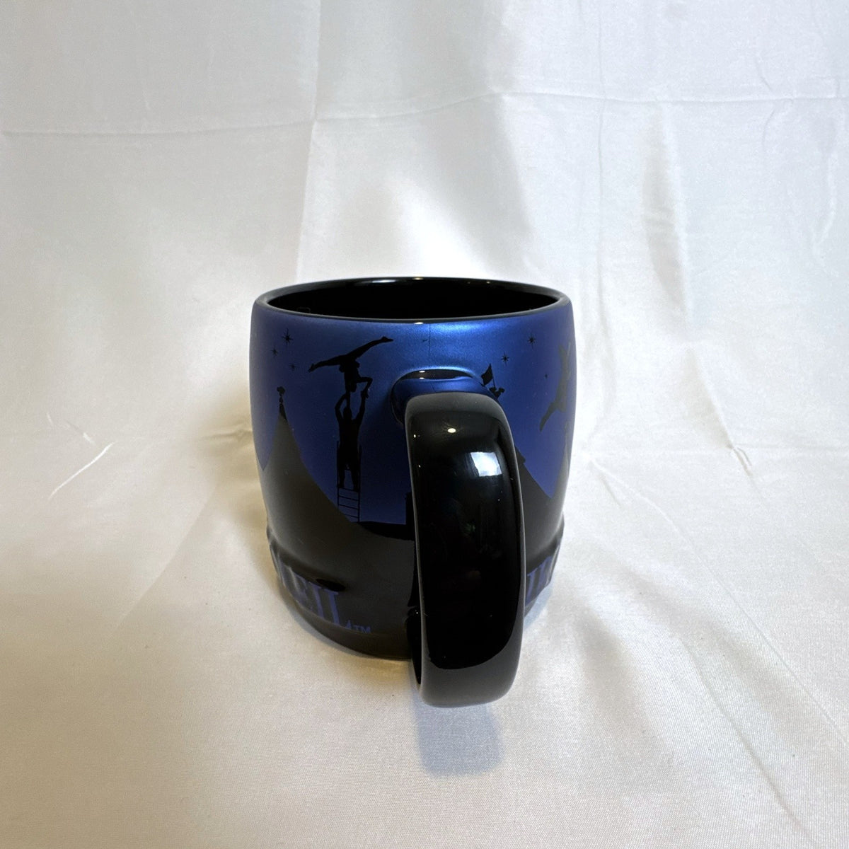 Cirque du Soleil 2015 oversized black ceramic mug featuring a starry night sky design
