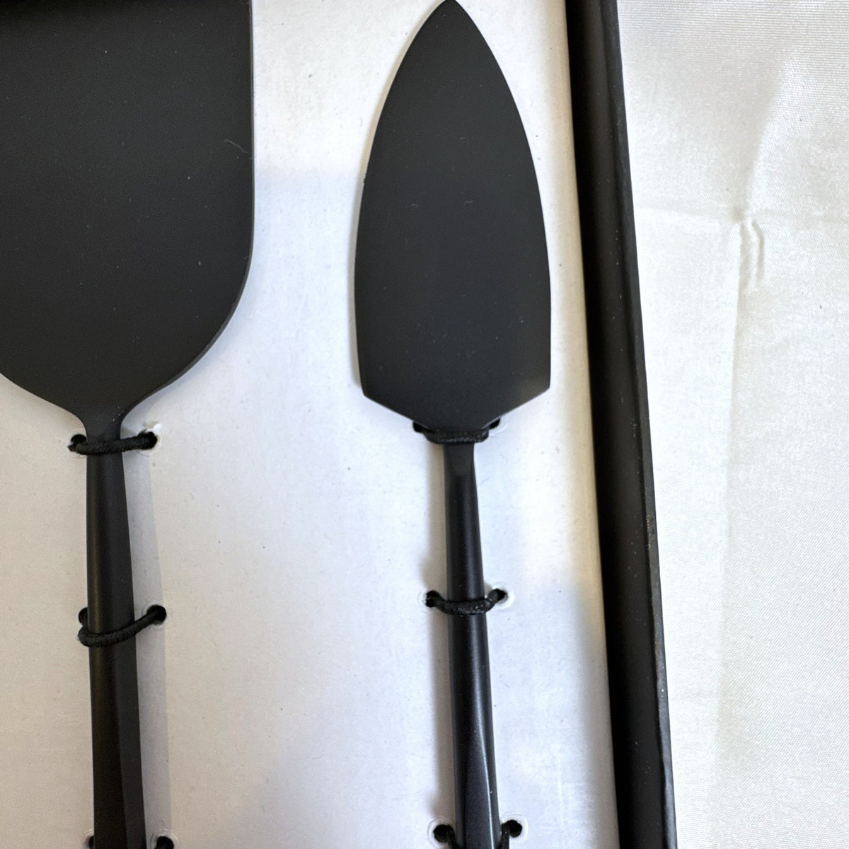 Crate and Barrel matte black stainless steel cheese knife set for charcuterie serving