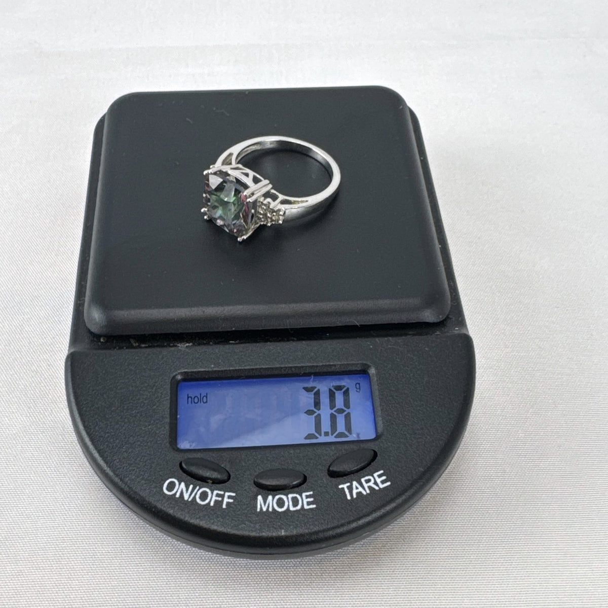 Cushion cut mystic topaz ring in 10K white gold with clear accent stones, size 7