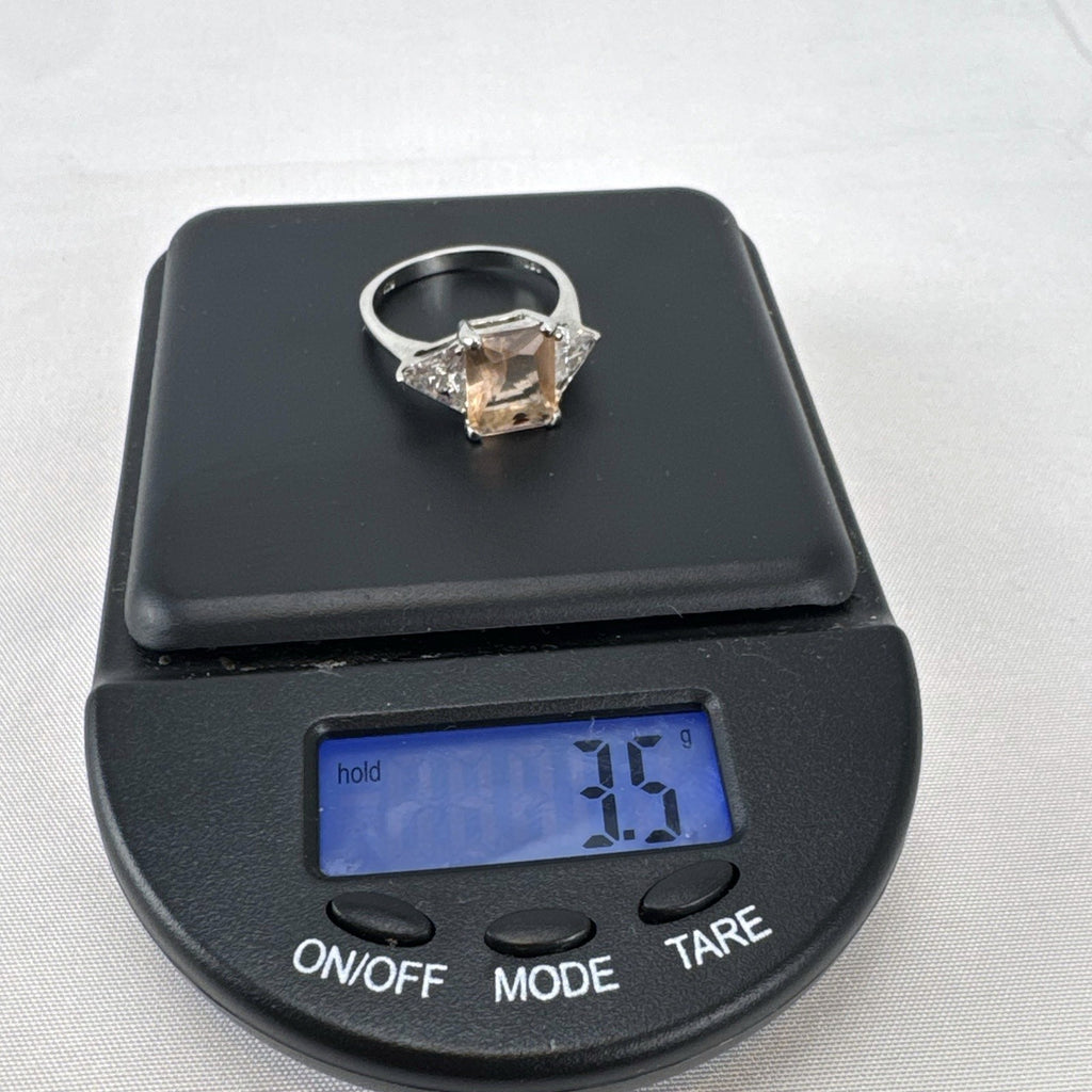 DBJ 925 sterling silver 3-stone ring with champagne emerald-cut CZ and clear trillion side stones size 7