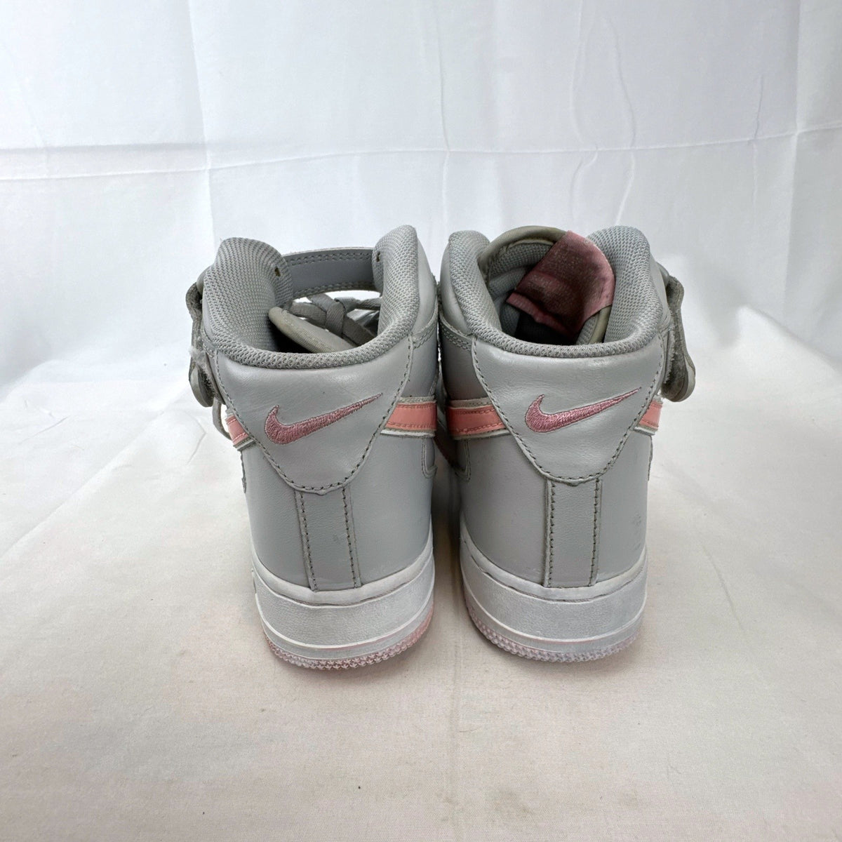 Women's Nike Air Force 1 Mid sneakers in grey leather with pink accents and ankle strap, size 7.5