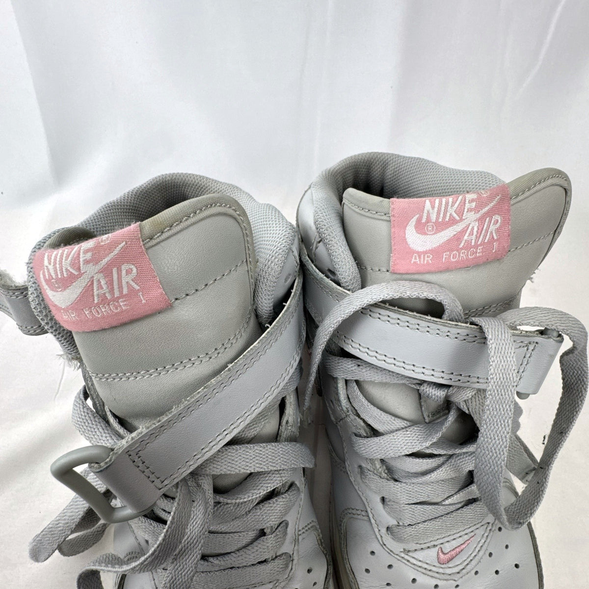 Women's Nike Air Force 1 Mid sneakers in grey leather with pink accents and ankle strap, size 7.5