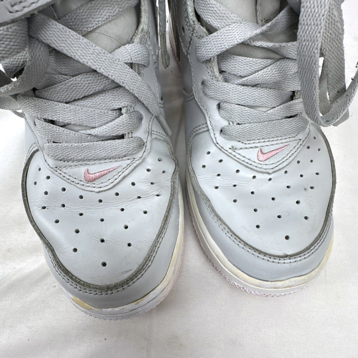 Women's Nike Air Force 1 Mid sneakers in grey leather with pink accents and ankle strap, size 7.5