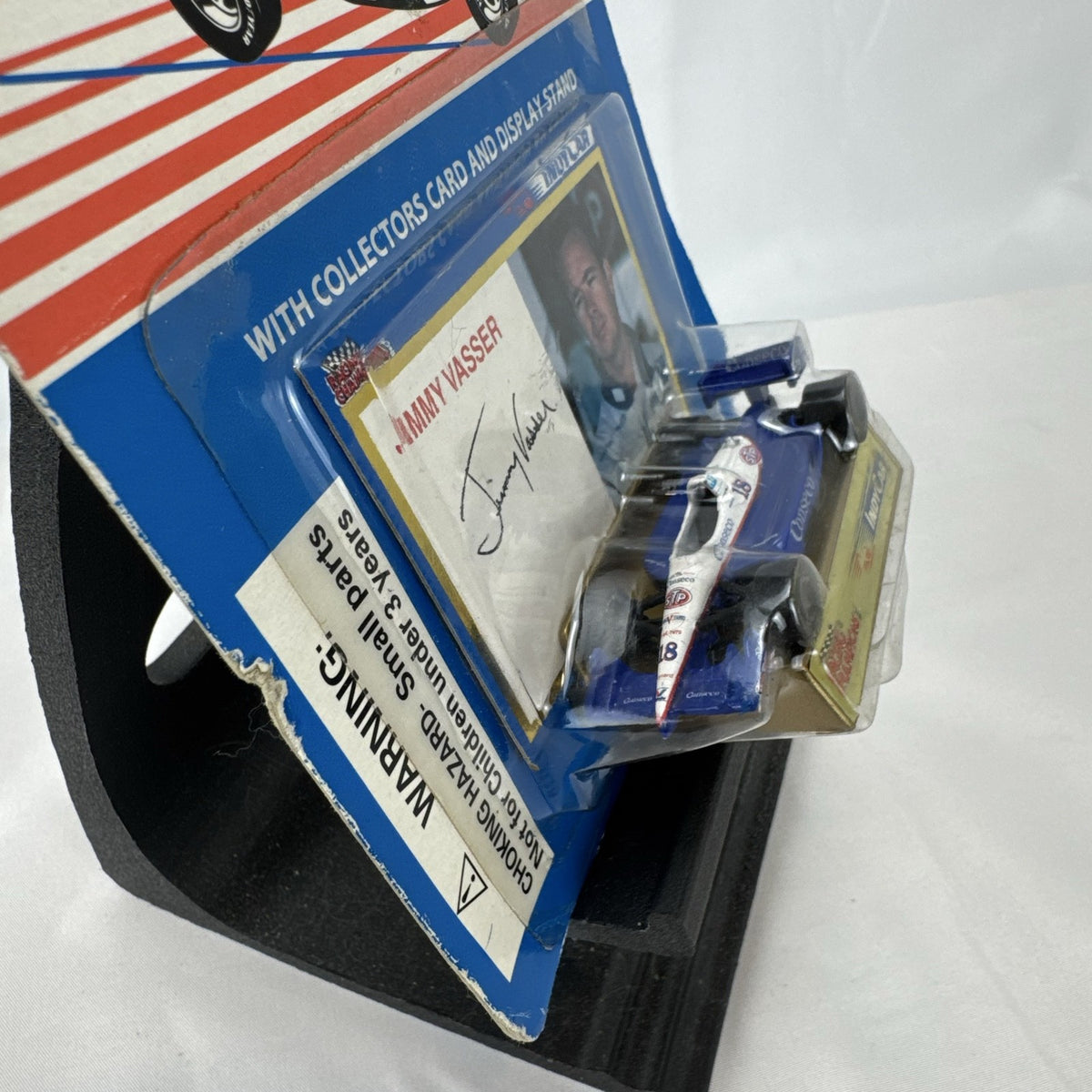 1994 Racing Champions Jimmy Vasser #18 Conseco IndyCar 1:64 scale diecast car sealed on original card with stand