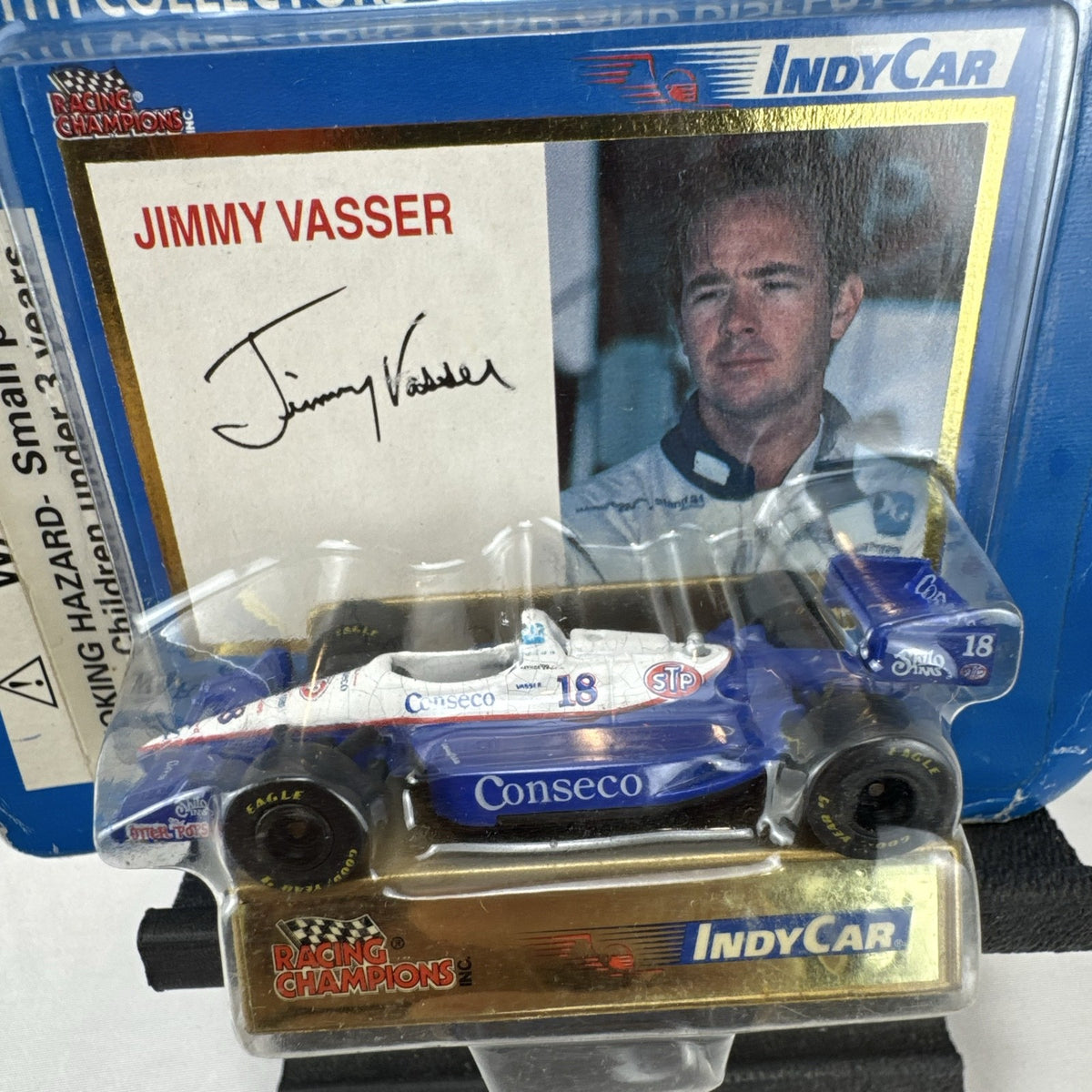 1994 Racing Champions Jimmy Vasser #18 Conseco IndyCar 1:64 scale diecast car sealed on original card with stand