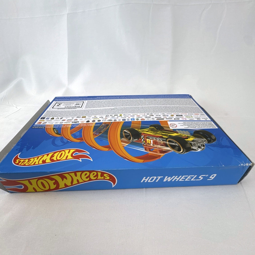Hot Wheels 1:64 scale diecast 9-car gift set featuring exclusive metallic green Le Mans racer and off-road buggies.