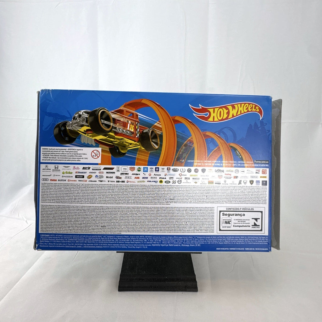 Hot Wheels 1:64 scale diecast 9-car gift set featuring exclusive metallic green Le Mans racer and off-road buggies.