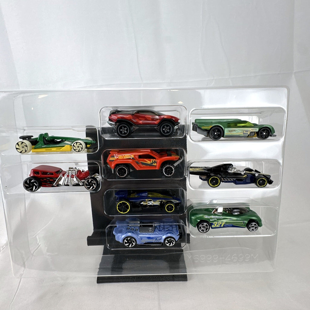Hot Wheels 1:64 scale diecast 9-car gift set featuring exclusive metallic green Le Mans racer and off-road buggies.