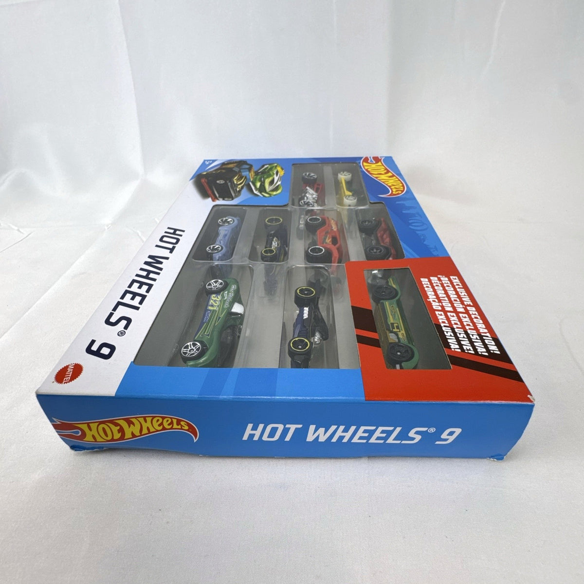 Hot Wheels 1:64 scale diecast 9-car gift set featuring exclusive metallic green Le Mans racer and off-road buggies.