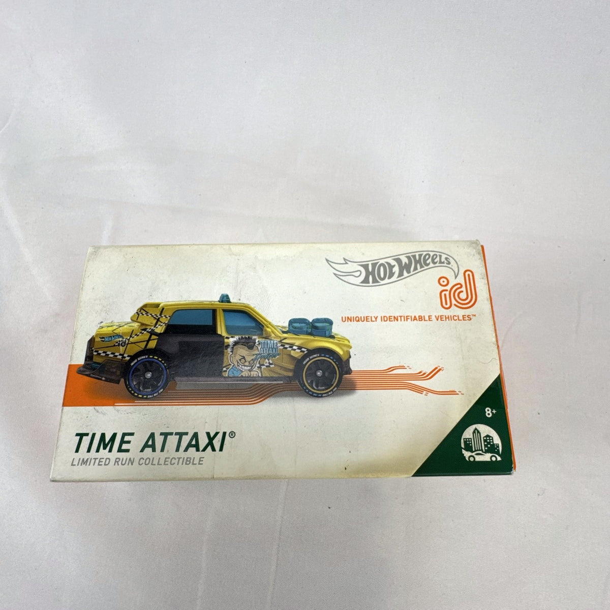Hot Wheels id Time Attaxi 1:64 scale diecast car in metallic gold with original packaging