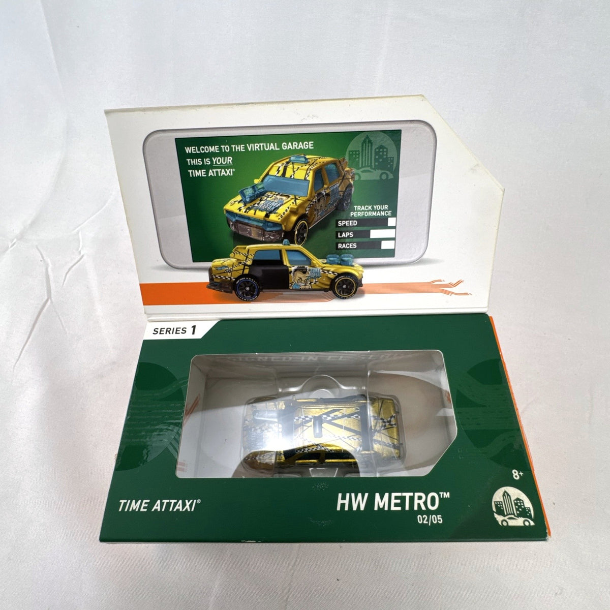 Hot Wheels id Time Attaxi 1:64 scale diecast car in metallic gold with original packaging